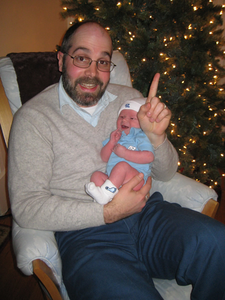 We are #1 (oops...were #1). Jackie and her dad are pictured here jinxing the Tar Heels. Cool Carolina threads courtesy of Elizabeth and Noah.