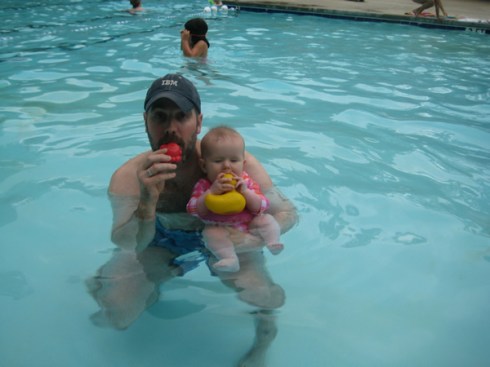 Jackie and Dad tasting pool toys